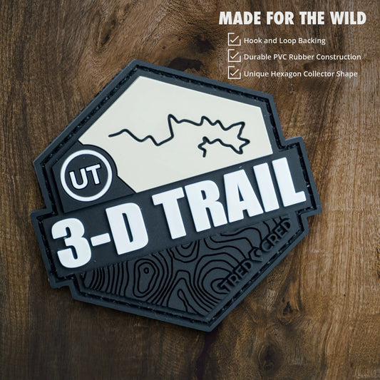 Tred Cred 3-D Trail PVC rubber patch with hook and loop backing featuring a topographic map design in black and white.
