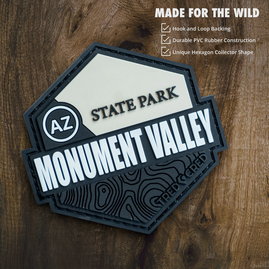 Tred Cred Monument Valley State Park hexagon PVC patch with hook and loop backing on a wooden surface