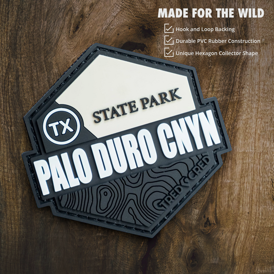 Tred Cred Palo Duro Canyon State Park hexagon PVC patch with hook and loop backing on a wooden background
