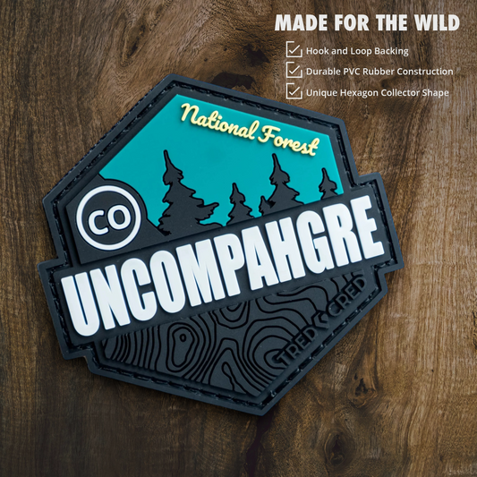 Tred Cred Uncompahgre National Forest hexagon PVC patch with teal and black mountain design and hook-loop backing.
