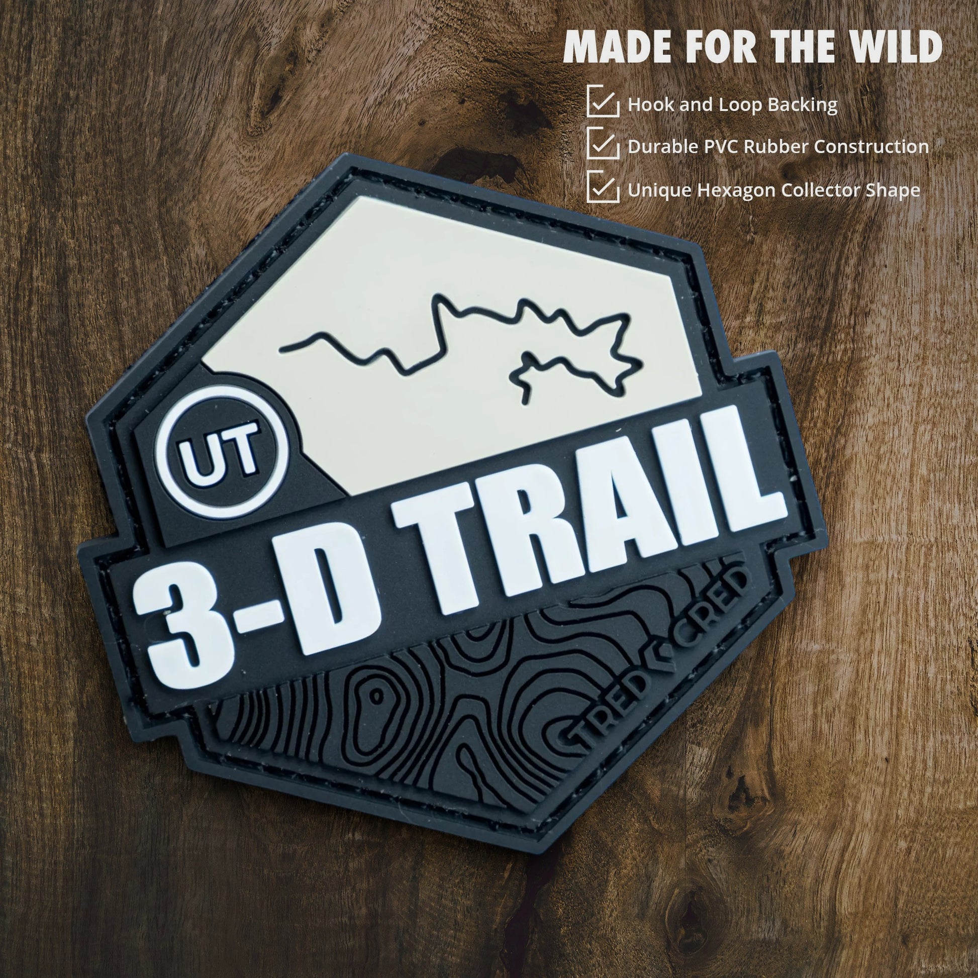 Tred Cred 3-D Trail PVC rubber patch with hook and loop backing featuring a topographic map design in black and white.