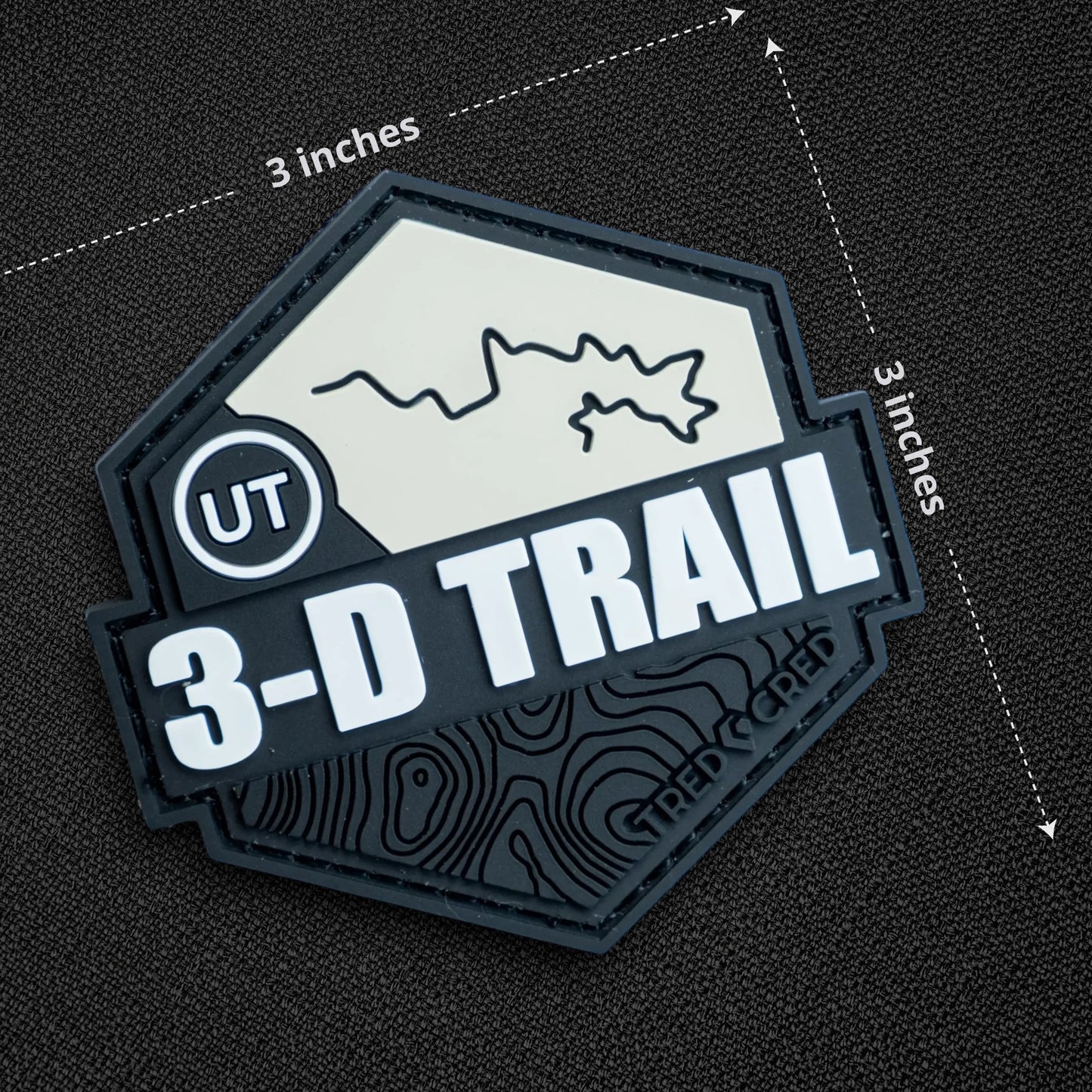 Tred Cred 3-D Trail patch in black and white PVC rubber with a hook and loop backing and topographic map design.