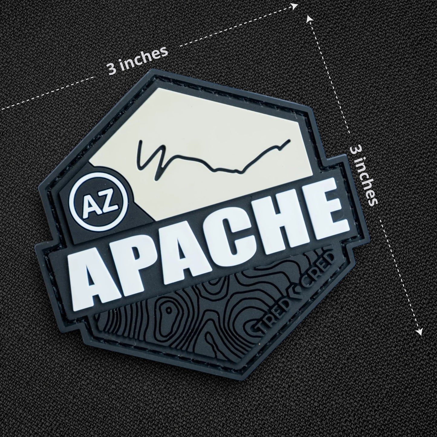 Tred Cred Apache trail patch in black and white PVC rubber with a hexagonal shape and topographic map design.