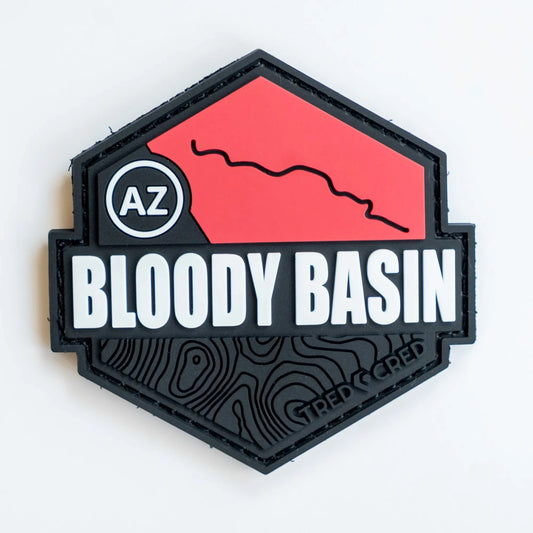Tred Cred Bloody Basin hexagonal PVC trail patch in red and black with AZ Arizona map detail and topographic lines