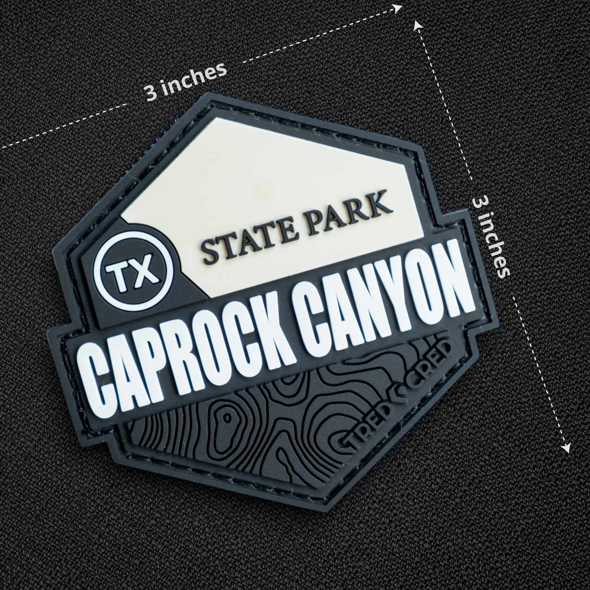 Tred Cred Caprock Canyon State Park PVC patch with hook and loop backing, featuring a topographic map design.