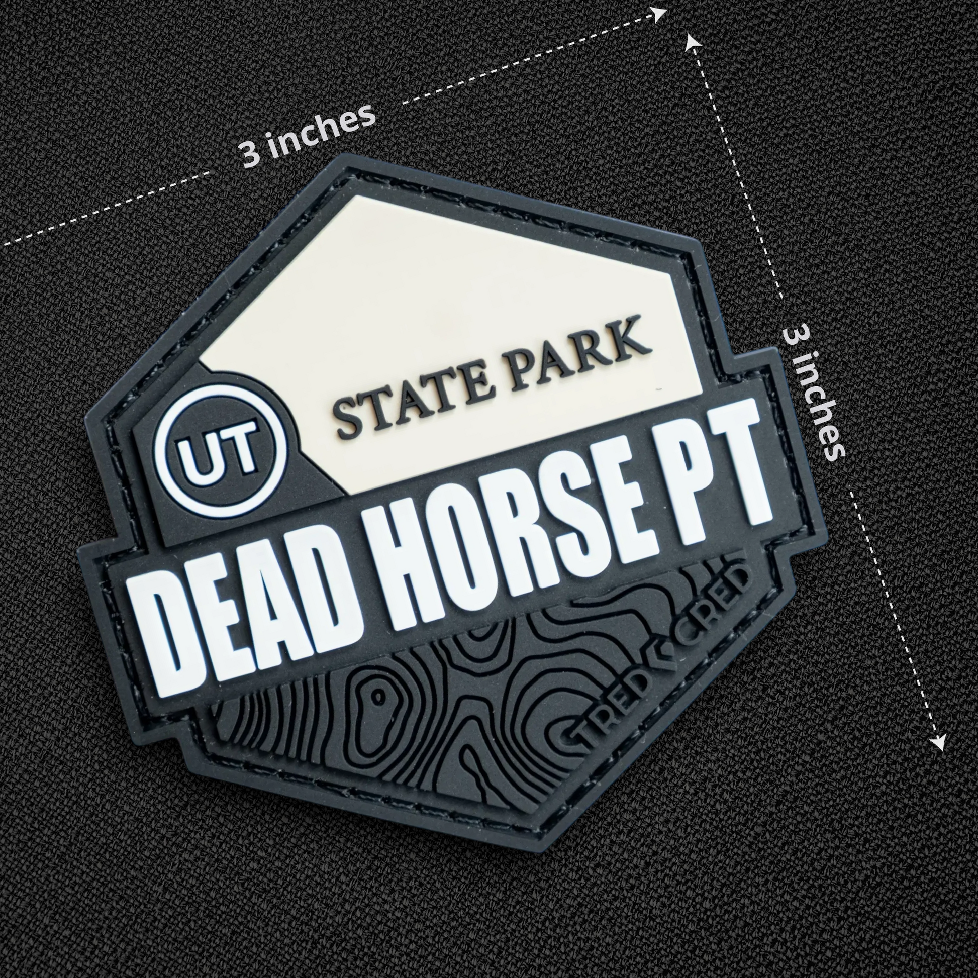 Tred Cred Dead Horse Point State Park PVC patch with topographic map design and hook and loop backing.