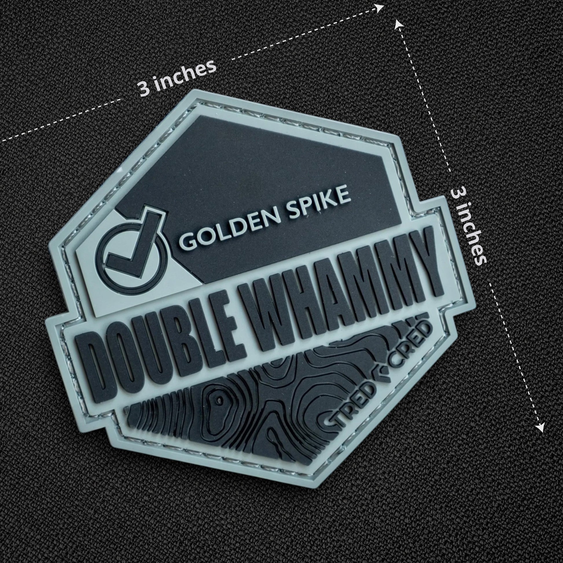 Tred Cred Double Whammy 3x3 inch PVC rubber trail patch with topographic map design and hook and loop backing.