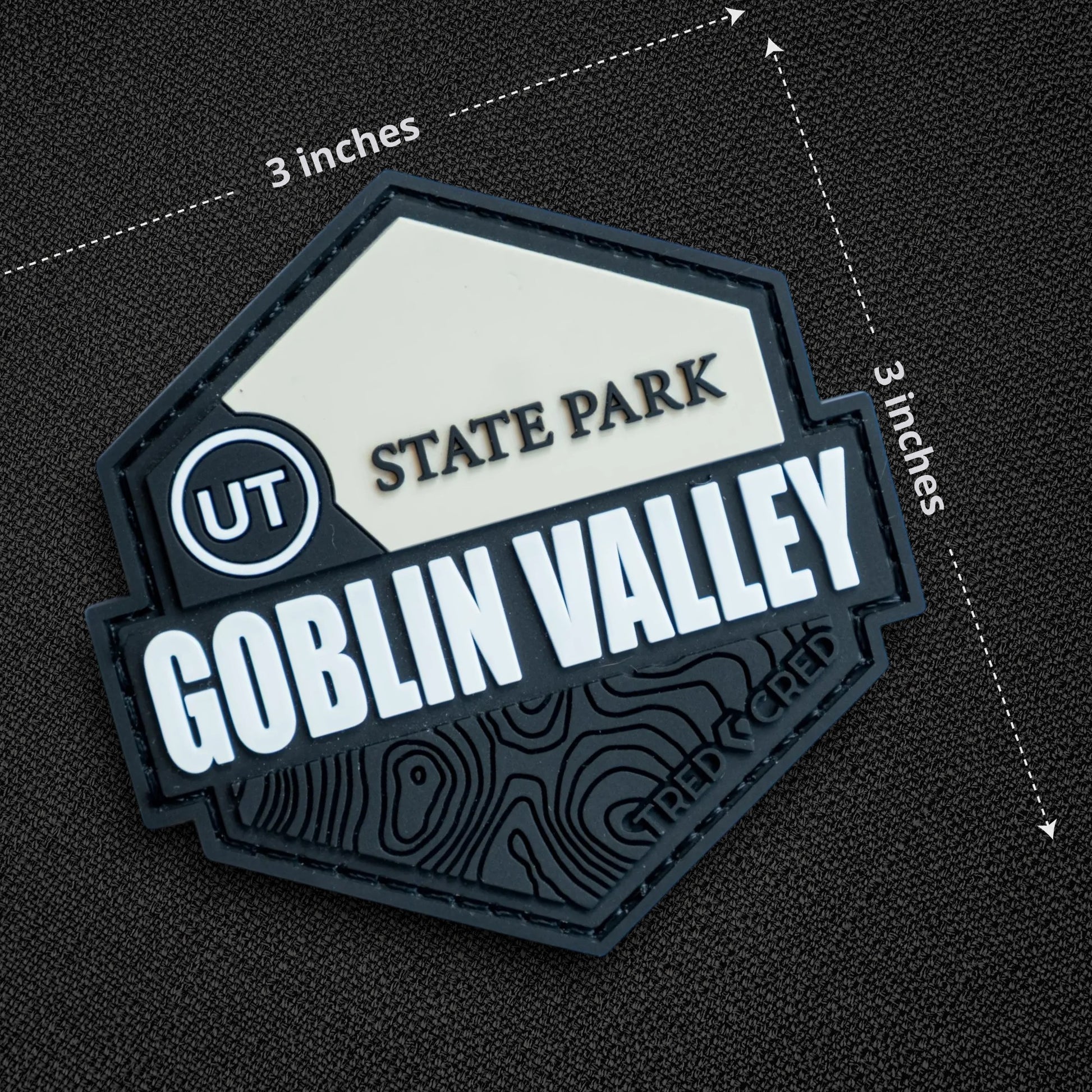 Tred Cred Goblin Valley State Park PVC patch with hook and loop backing, featuring a black and white topographic design.