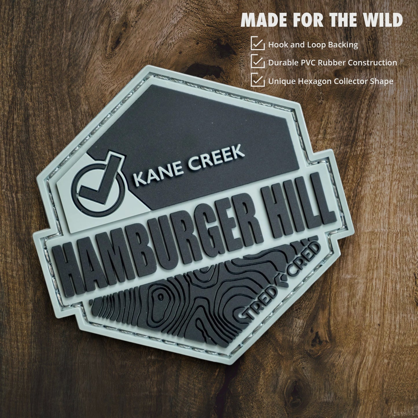 Tred Cred Hamburger Hill PVC trail patch with topographic map design and hook and loop backing
