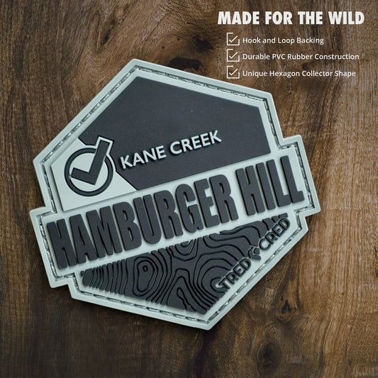 Tred Cred Hamburger Hill PVC trail patch with topographic map design and hook and loop backing
