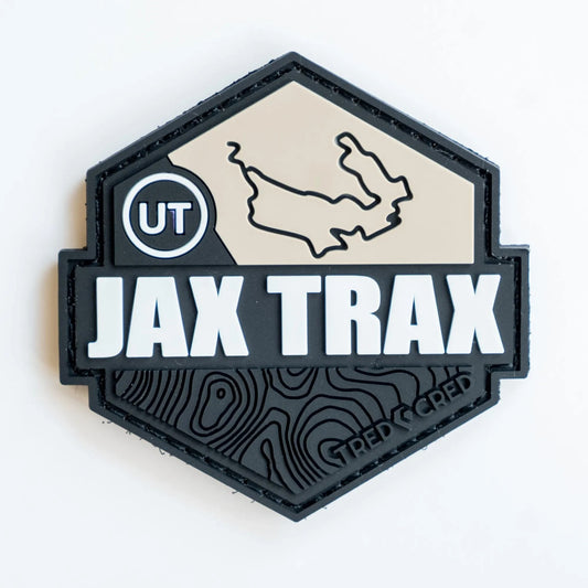 Tred Cred Jax Trax hexagonal PVC trail patch with Utah map, topographic lines, and hook and loop backing.