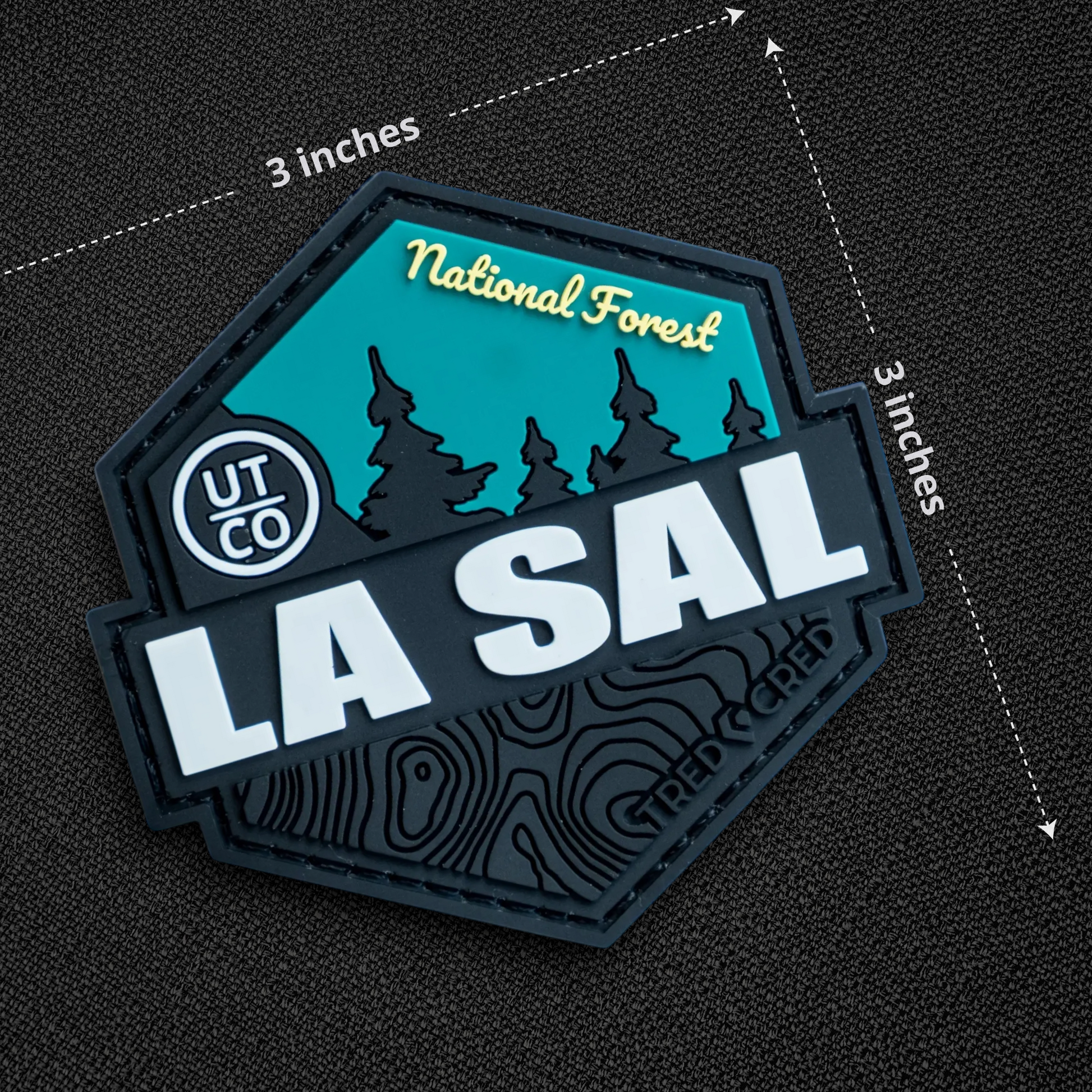 Tred Cred La Sal National Forest PVC patch with teal and black mountain design and hook and loop backing