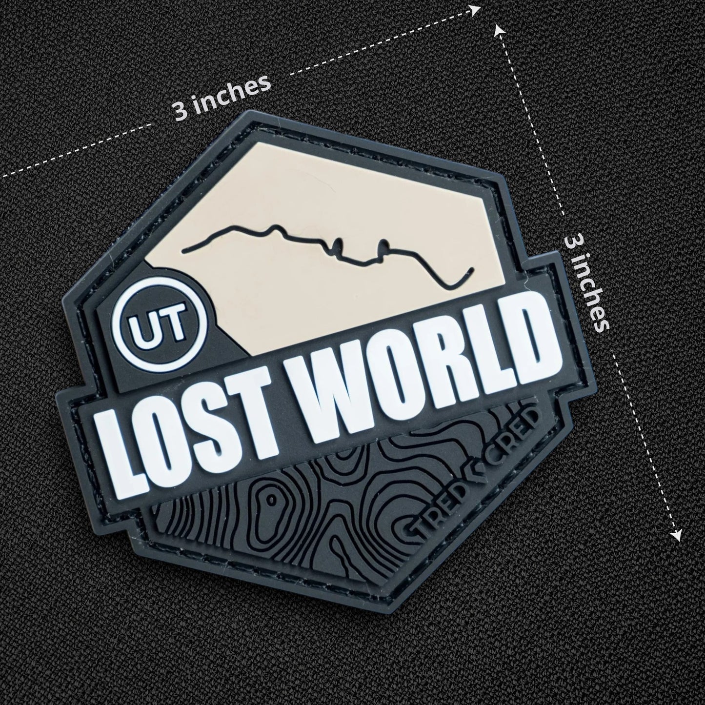 Tred Cred Lost World 3x3 inch PVC rubber trail patch with topographic map design and hook and loop backing