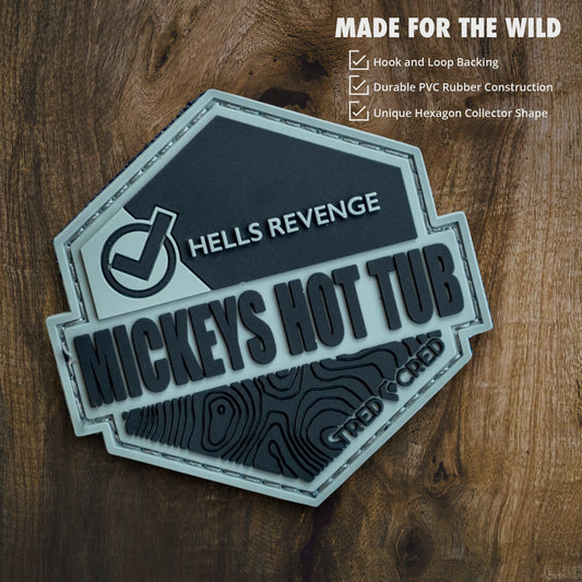 Tred Cred Mickeys Hot Tub PVC patch with Hells Revenge text, topographic map design, and hook and loop backing.