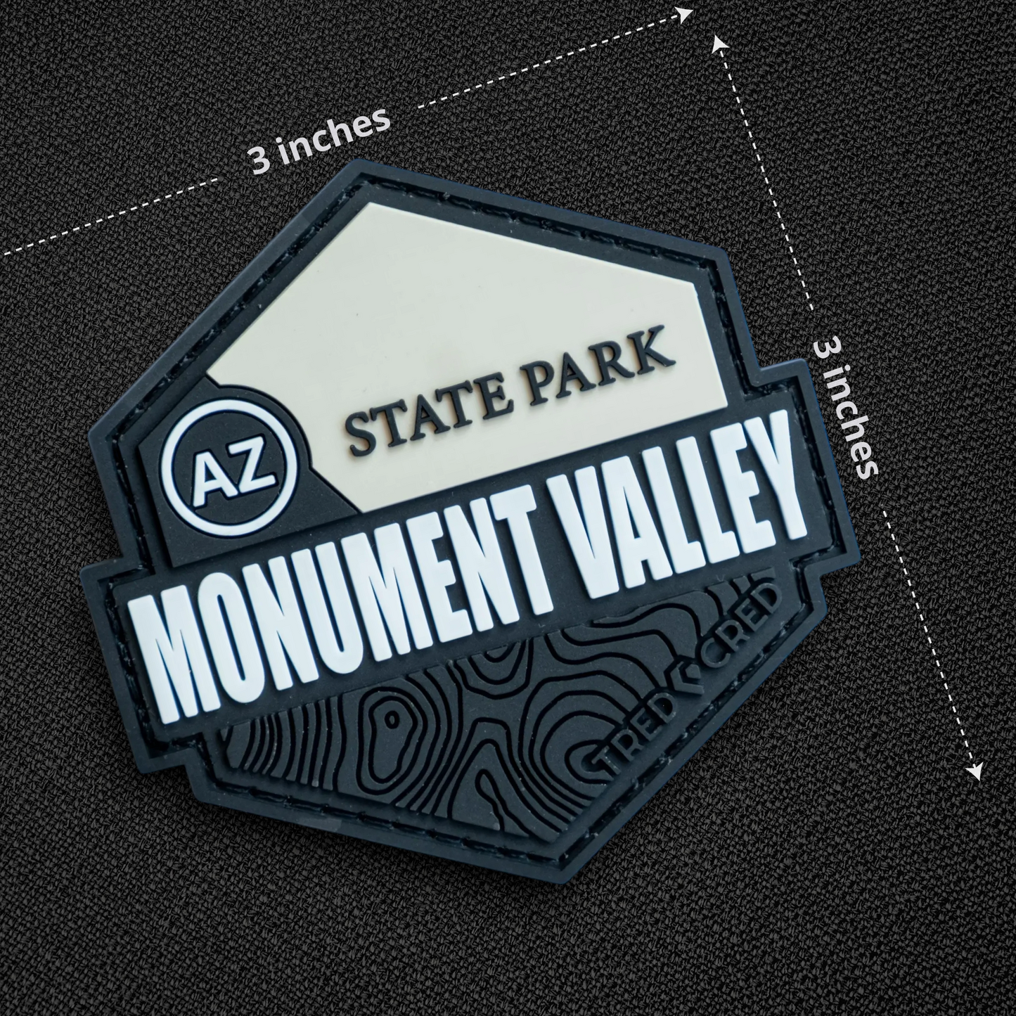 Tred Cred Monument Valley State Park PVC patch with hook and loop backing, featuring a topographic map design.