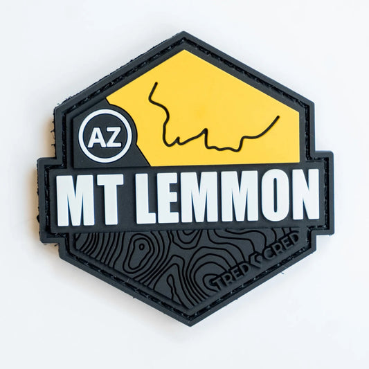 Tred Cred Mount Lemmon PVC trail patch with yellow and black topographic design and hook and loop backing.