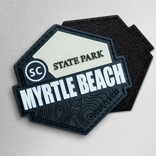 Tred Cred Myrtle Beach State Park hexagonal PVC patch with topographic map details and hook and loop backing.