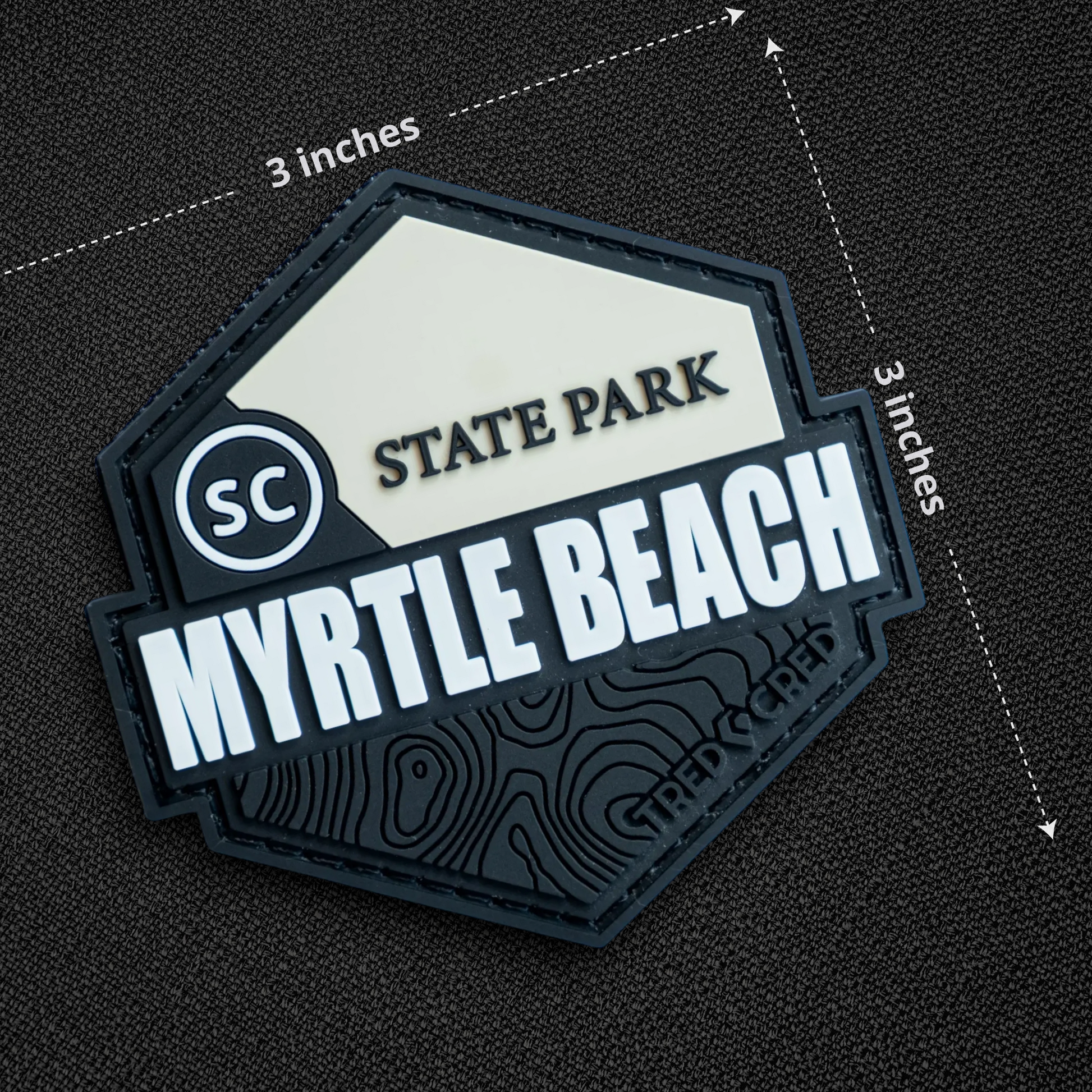 Tred Cred Myrtle Beach State Park PVC patch with hook and loop backing, featuring topographic map design.