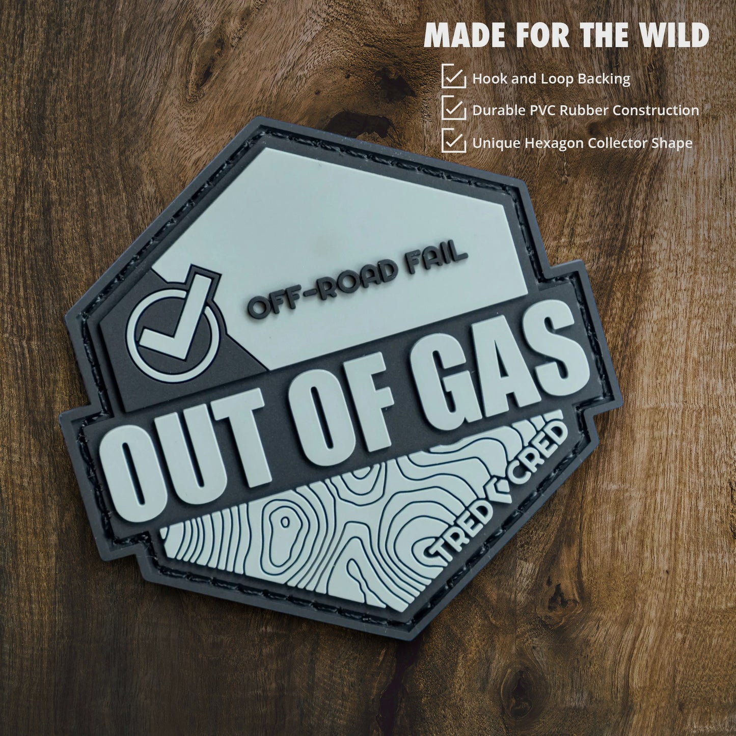 Tred Cred Out of Gas PVC patch with grey topographic design, checkmark icon, and hook and loop backing.