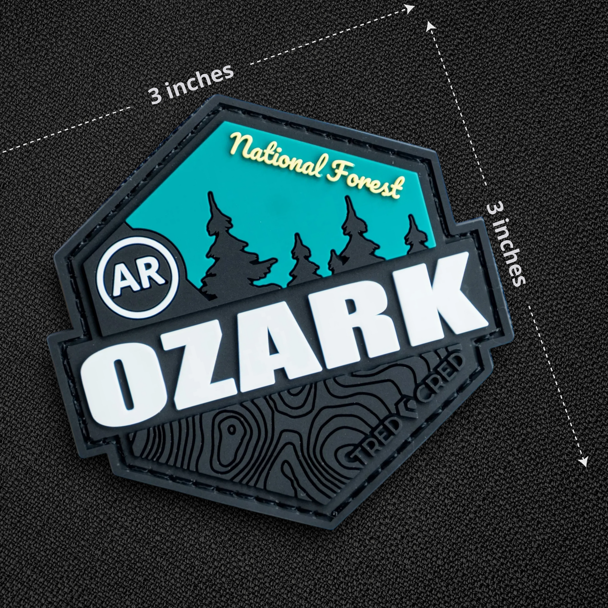 Tred Cred Ozark National Forest PVC patch with teal and black design, featuring topographic lines and hook backing.