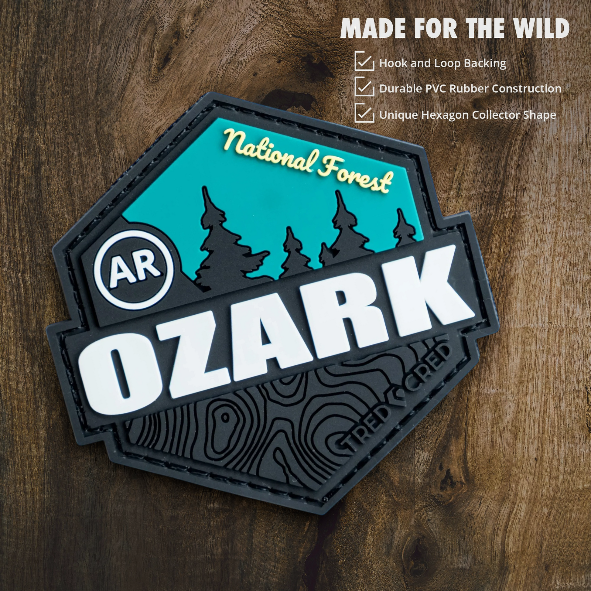 Tred Cred Ozark National Forest hexagon PVC patch with teal and black topographic design and hook and loop backing.