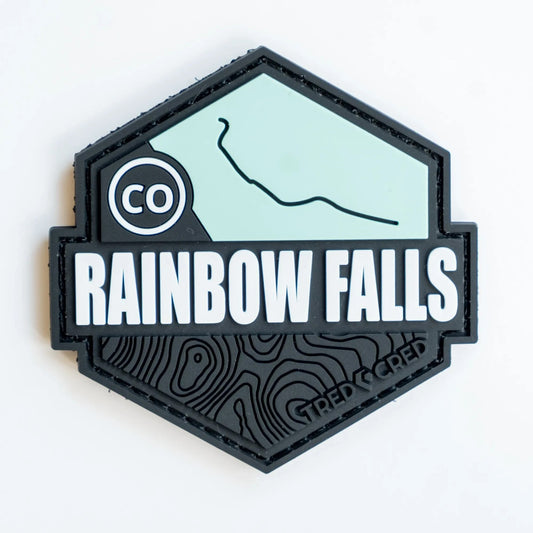Tred Cred Rainbow Falls hexagonal PVC trail patch with topographic map details and hook and loop backing.