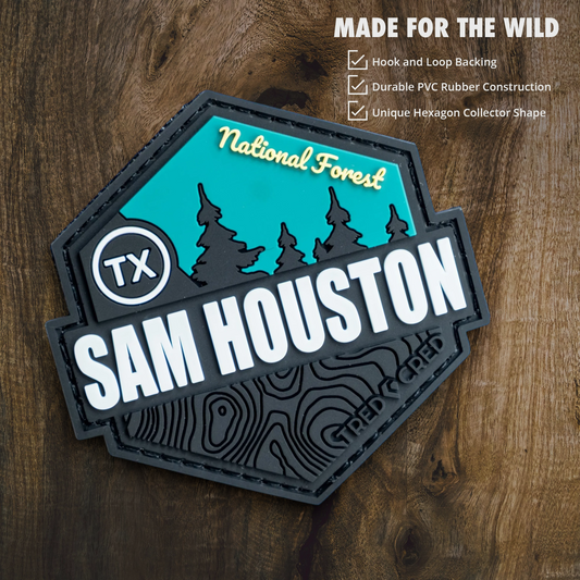Tred Cred Sam Houston National Forest hexagon PVC patch with teal and black topographic design on wood background.