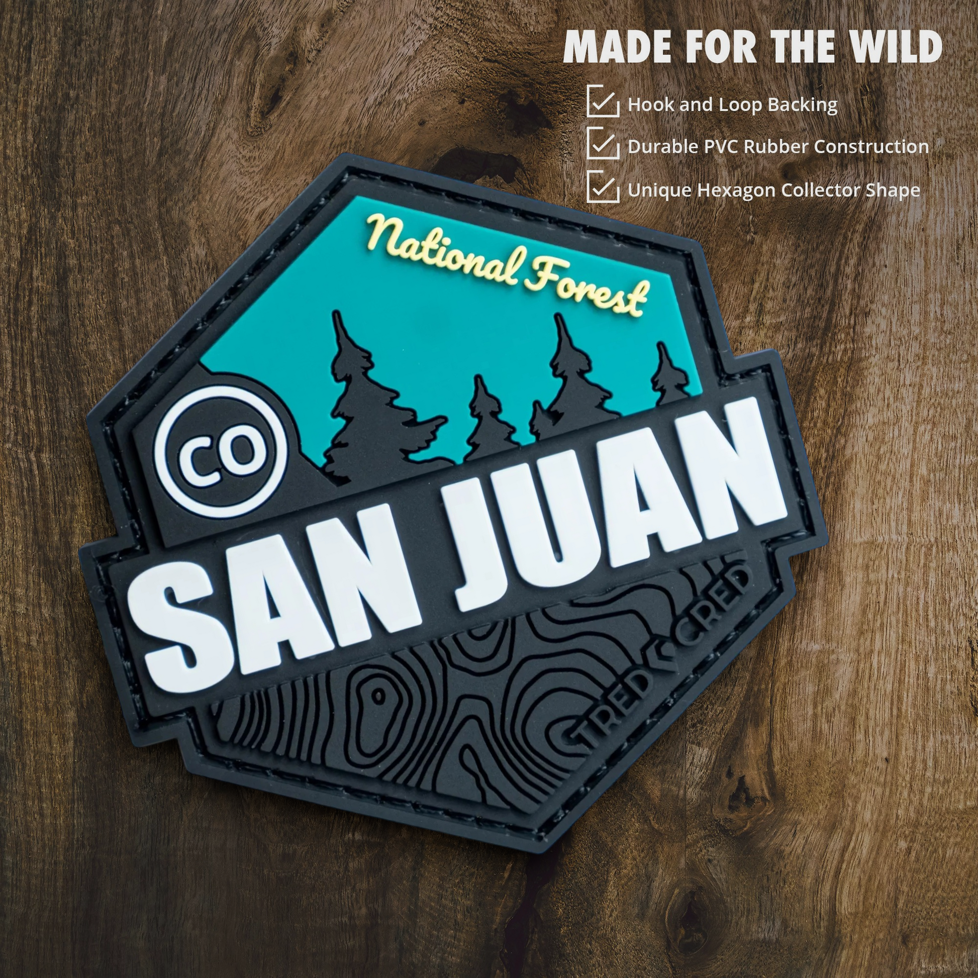 Tred Cred San Juan National Forest hexagon PVC patch with black, teal, and white topographic mountain design.