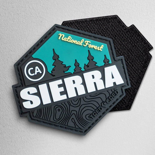 Tred Cred Sierra National Forest hexagonal PVC patch with black, teal, and white topographical design.