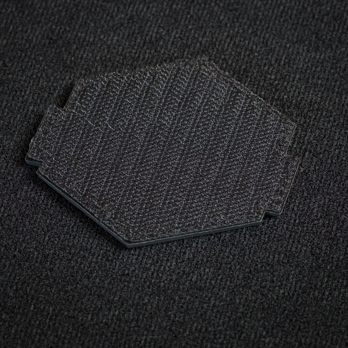 Tred Cred Sierra National Forest patch showing the black hook and loop backing on a dark fabric surface.