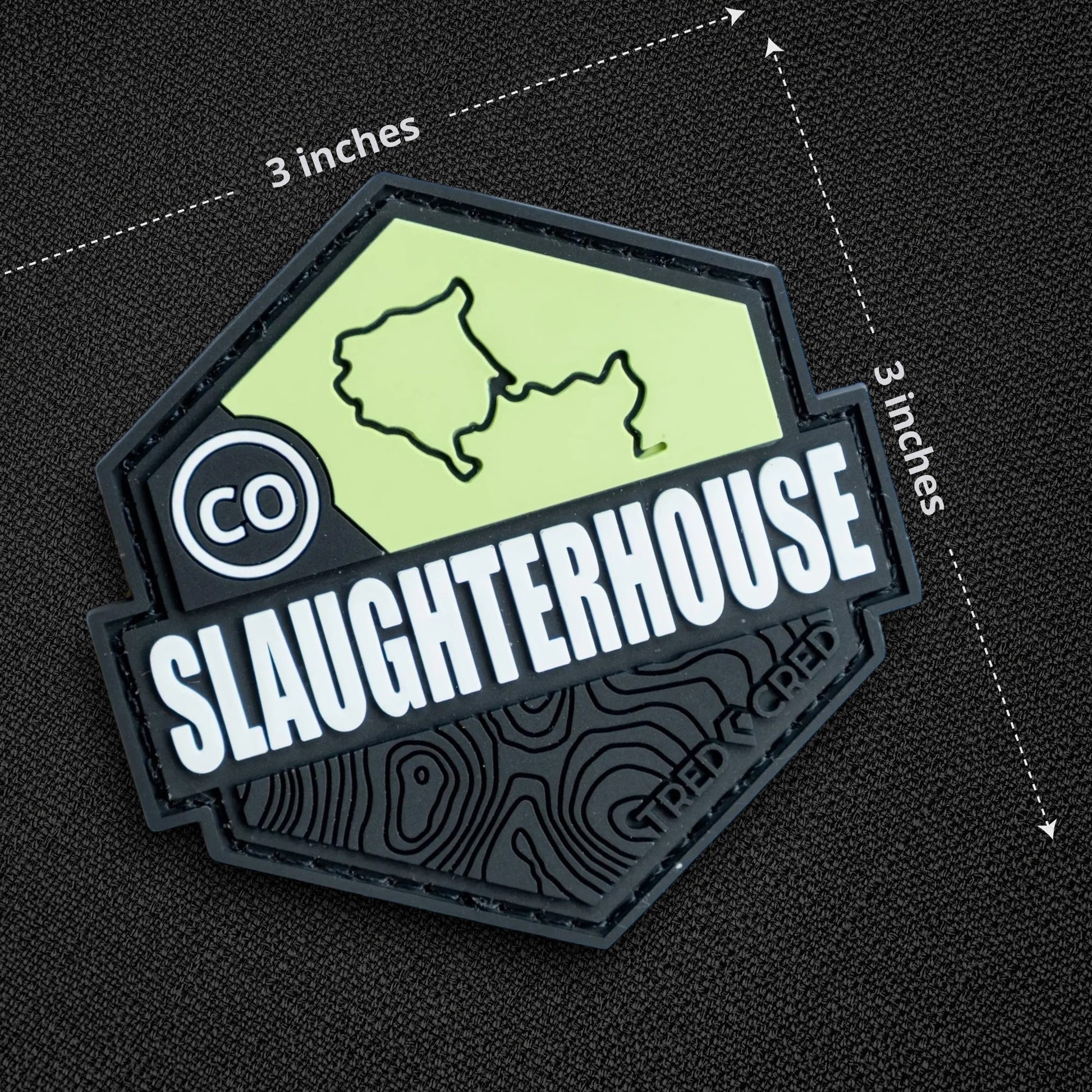 Tred Cred Slaughterhouse trail patch in light green and black PVC rubber with a 3x3 inch hexagonal design.