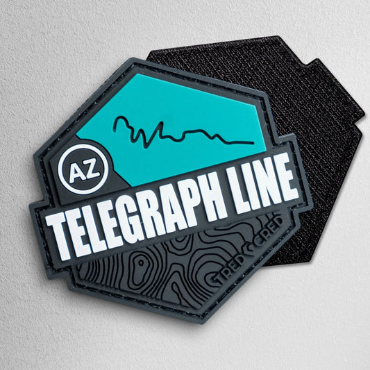 Tred Cred Telegraph Line hexagonal PVC trail patch in teal and black with AZ badge and topographic map details.