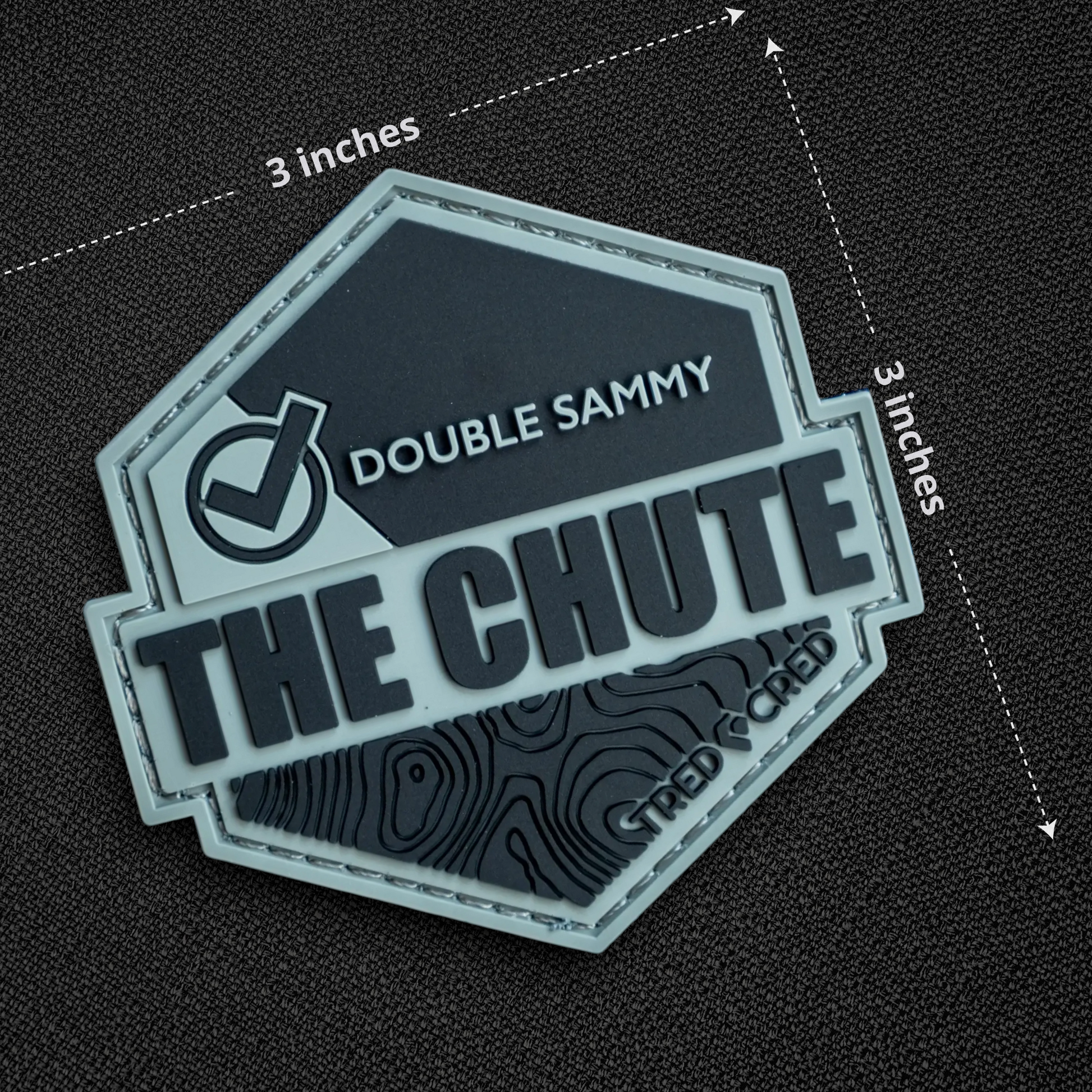 Tred Cred The Chute hexagonal PVC rubber trail patch with topographic map design and hook and loop backing