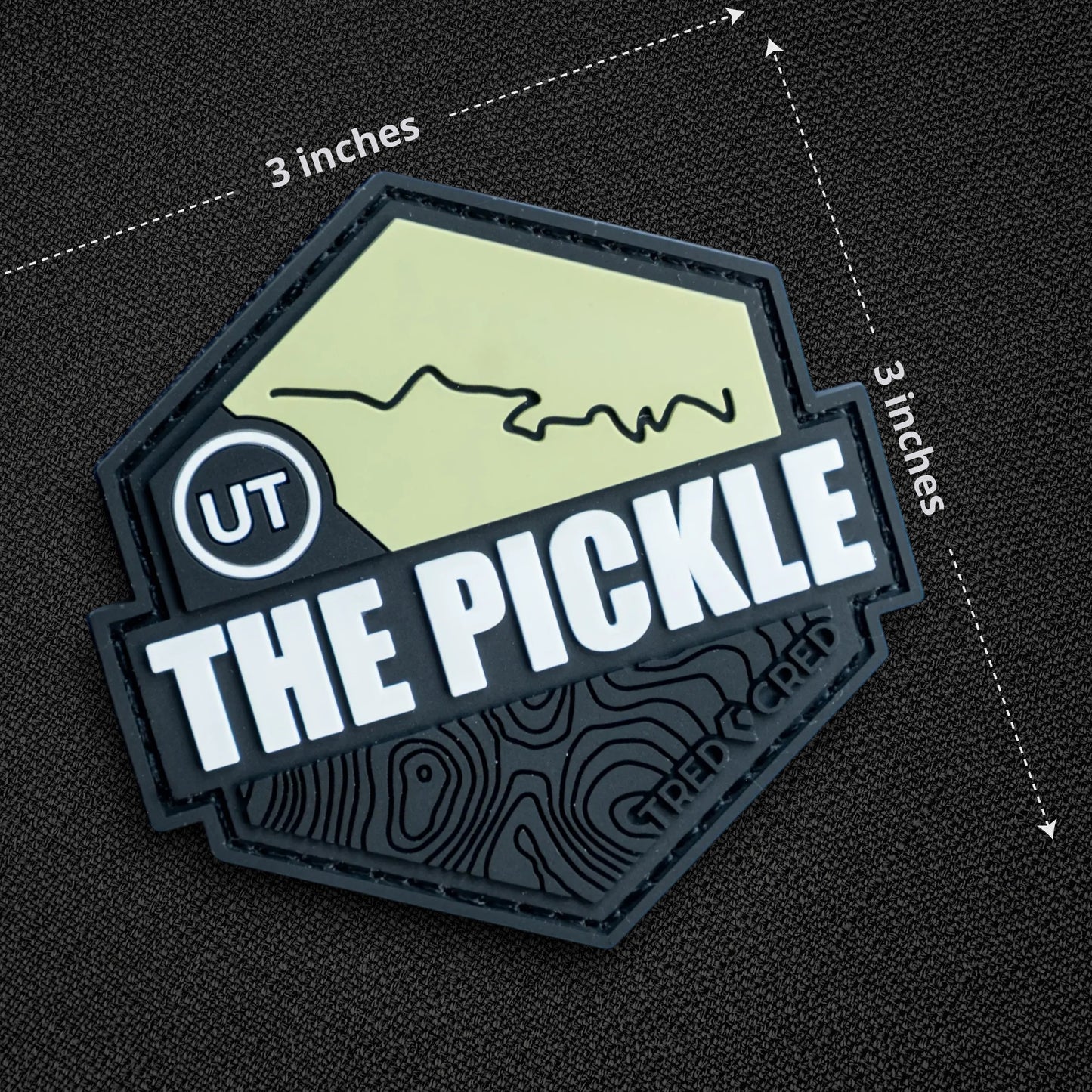 Tred Cred The Pickle PVC trail patch with a hexagonal shape, green trail map, and hook and loop backing.