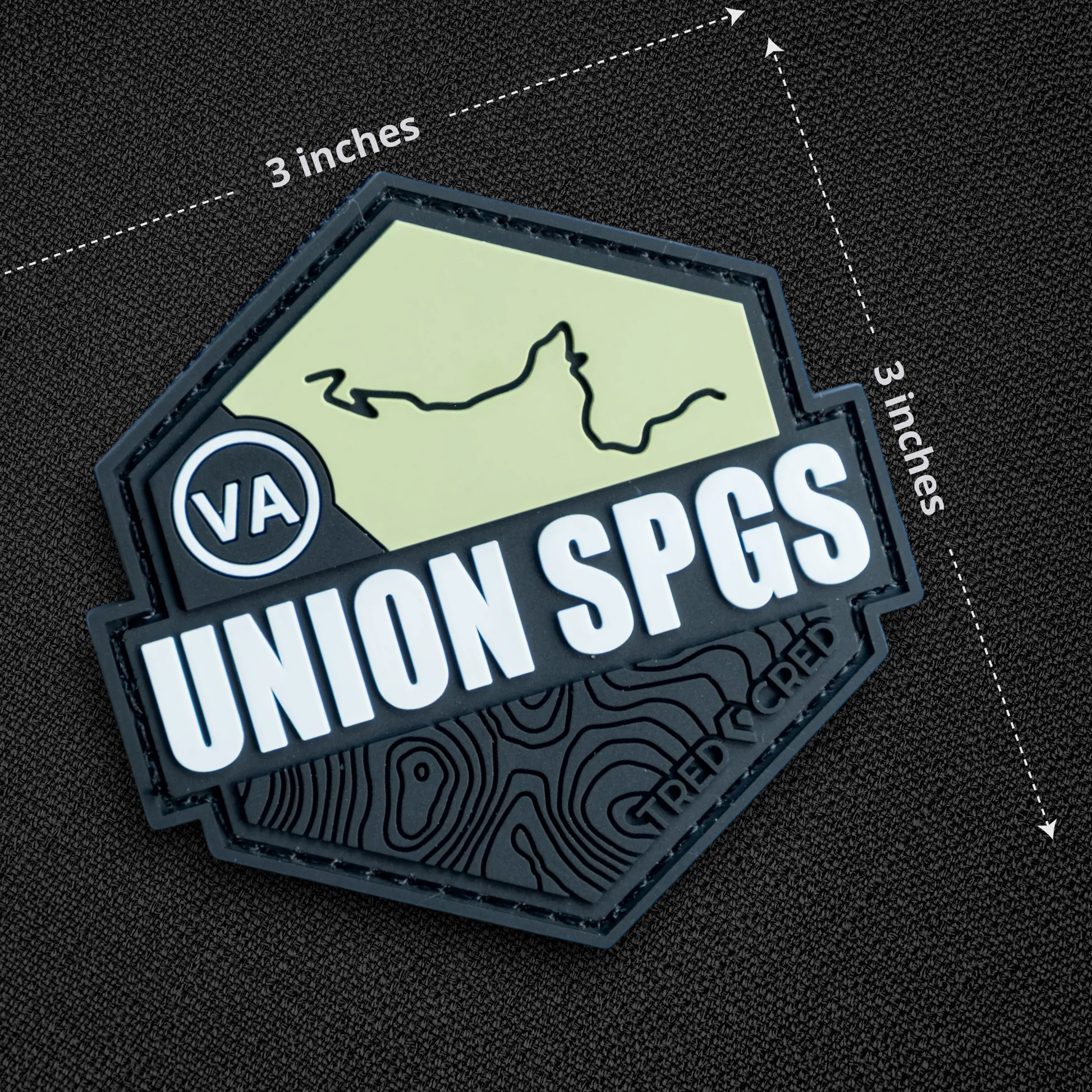 Tred Cred Union Springs trail patch, 3x3 inch hexagonal PVC rubber badge with hook and loop backing.